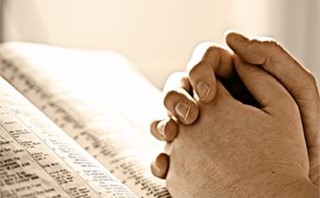 Hands on a Bible