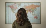 Woman Looking at World Map (79241)