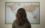 Woman Looking at World Map (79241)